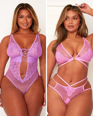 Woman wearing a pink lace lingerie set on a plain background