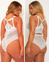 White lace lingerie set worn by a model on a plain background