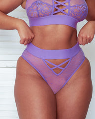 Close-up front view of the Abigail brief in Amethyst Orchid, featuring sheer polka-dot mesh, a wide waistband, and decorative criss-cross strap detailing at the front for a flattering, contemporary look.