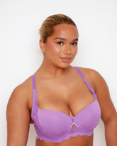 Close-up of Tutti Rouge Daley Lace bra in Amethyst Orchid on a model, showing smooth moulded cups, lace trim and centre cut-out.