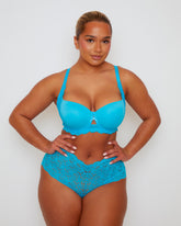 Front view of model wearing Tutti Rouge Daley Lace T-shirt bra in Bluebird Blue with matching scalloped floral lace briefs.