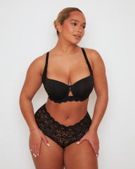 Front view of Tutti Rouge Daley bra in Midnight Black with centre cut-out detailing, worn with coordinating floral lace briefs.
