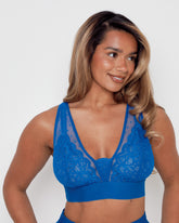 Close-up of the Hallie Bra in Dazzling Blue by Tutti Rouge, showcasing delicate floral lace cups, sheer dotted mesh detailing, and a supportive wide underband.