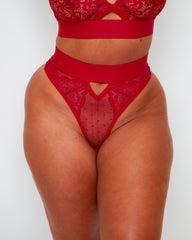 Front view of the Tutti Rouge Julisa Brazilian Brief in Raspberry Red with sheer dotted mesh, floral lace panels, cut-out front detail and high-waist fit.
