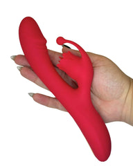 Red silicone Personal Toy held by a hand on a white background