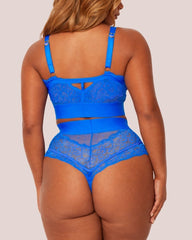 Blue lace lingerie set on a plain background