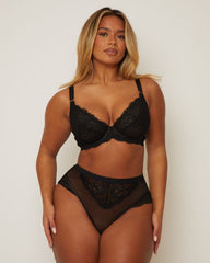 full length image of woman wearing a Tutti Rouge lace plunge bra and matching brazilian in midnight black