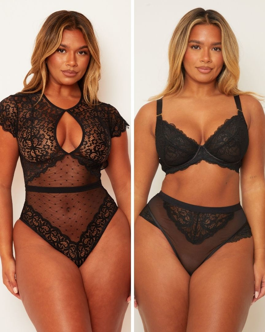 Black lace lingerie set worn by a model on a plain background