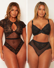 Black lace lingerie set worn by a model on a plain background