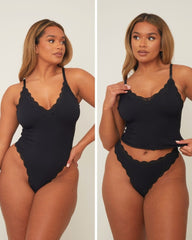 Woman modeling a black swimsuit set against a plain background