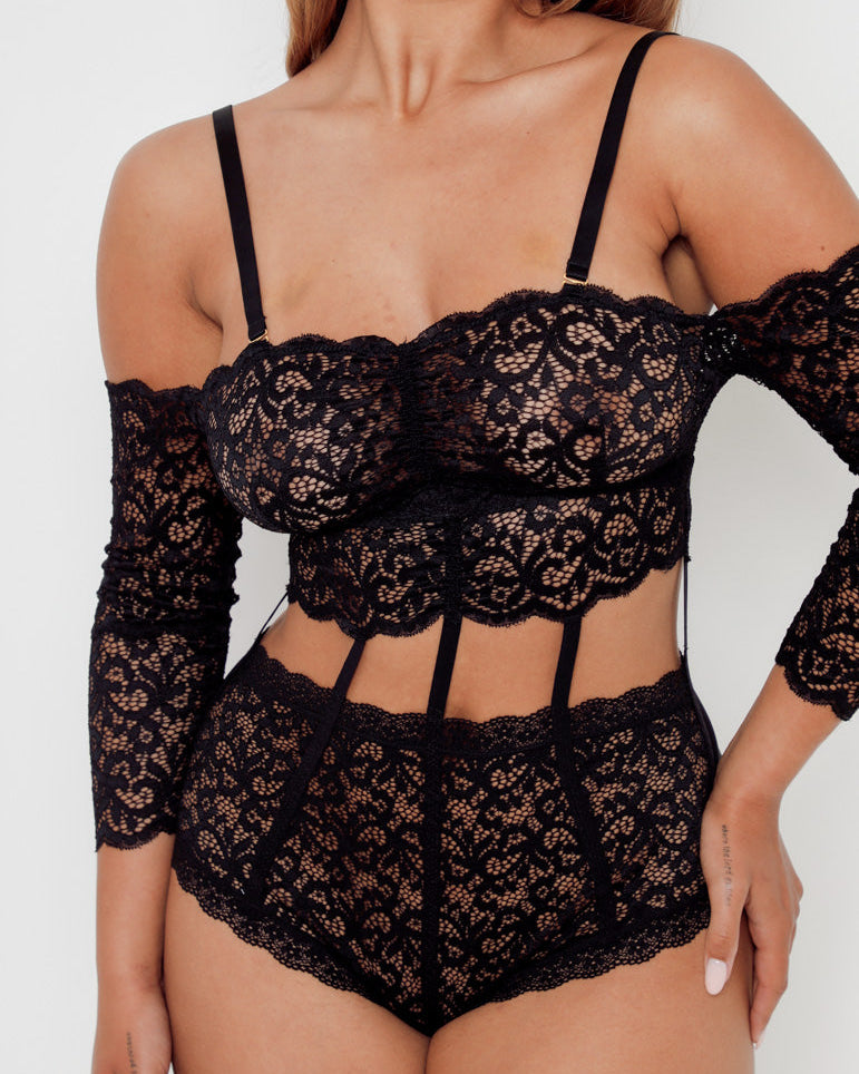 Close-up of the Alix Bodysuit in Midnight Black highlighting premium floral lace, corset-inspired panels and luxurious lingerie detailing.