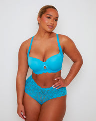 Model wearing Tutti Rouge Daley Lace bra in Bluebird Blue, featuring moulded cups and a lace underband, paired with blue lace briefs.