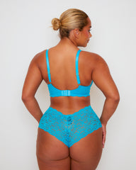 Rear view of Tutti Rouge Daley Lace bra in Bluebird Blue with gold heart strap adjusters, worn with matching floral lace briefs.