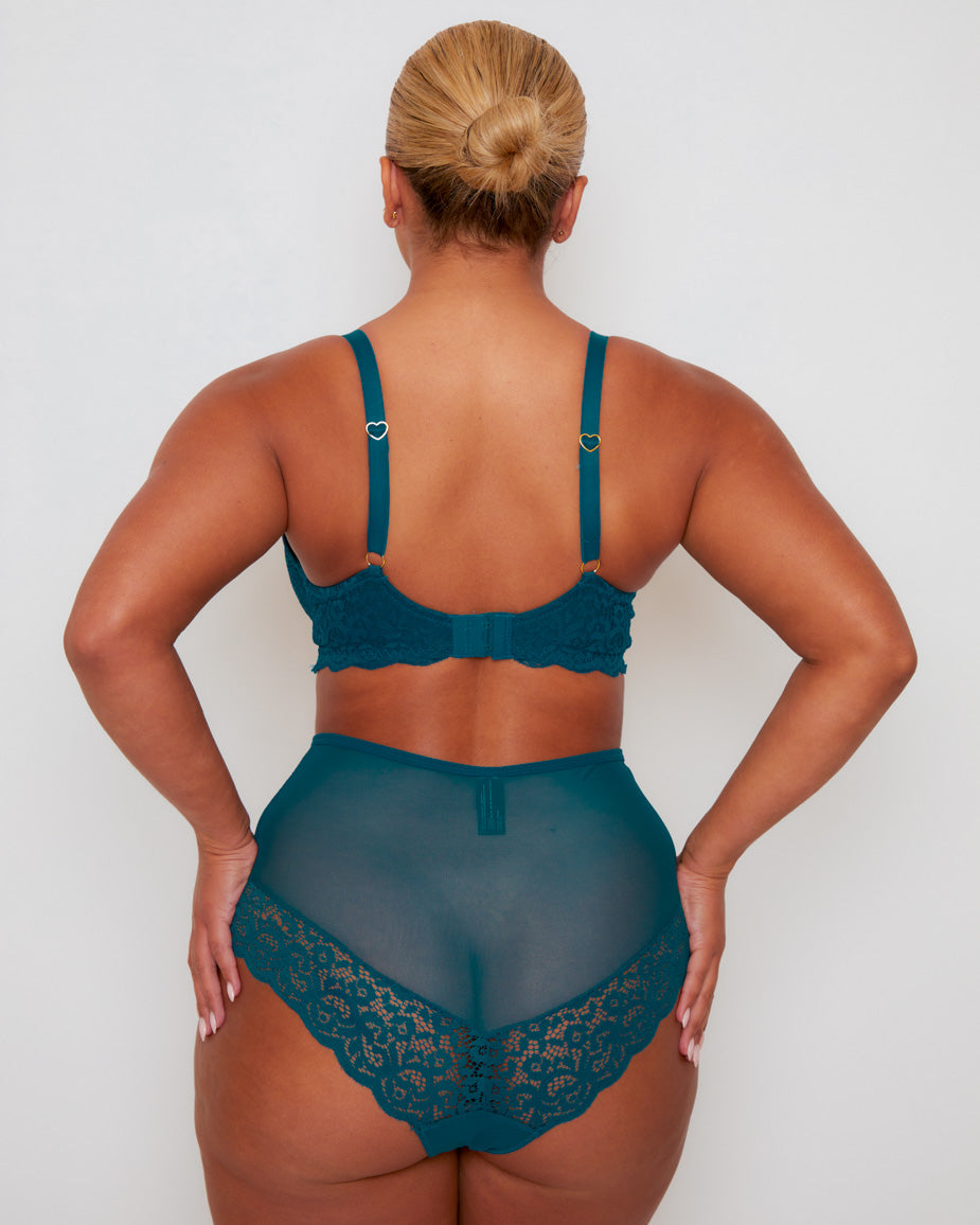 Back view of the Daley Lace T-Shirt Bra and Full Coverage Brief in Blue Coral, featuring adjustable shoulder straps with heart-shaped hardware, a secure hook-and-eye fastening, and a delicate lace thong design.