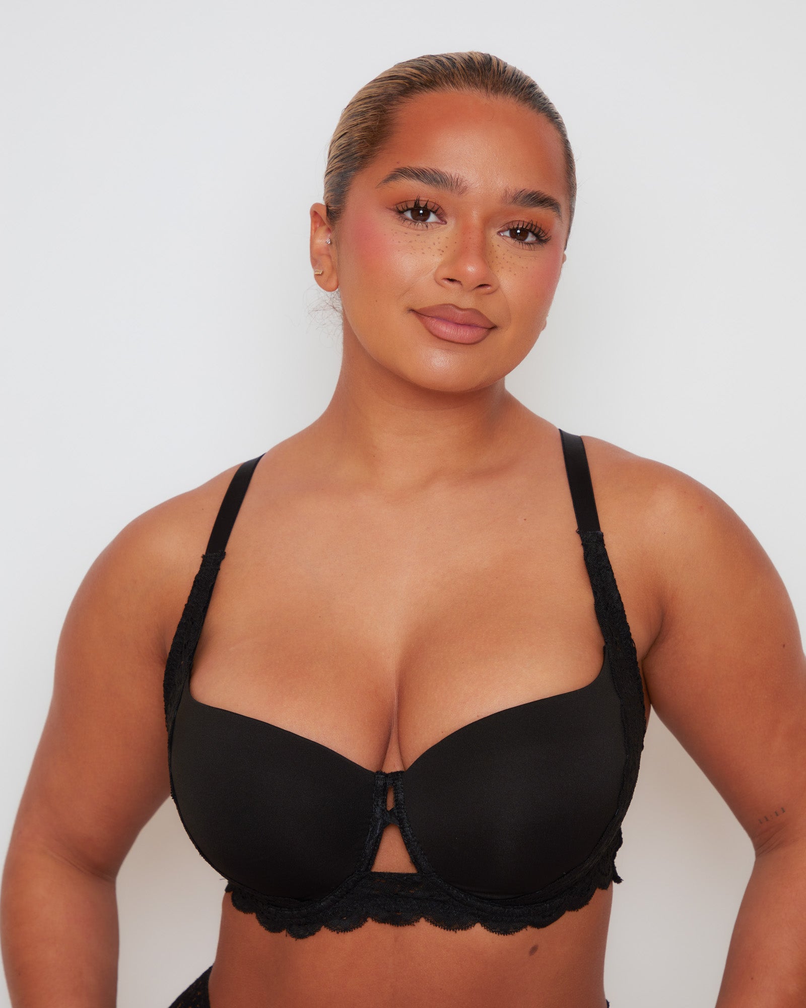 Close-up of Tutti Rouge Daley bra in Midnight Black, showing moulded cups, centre cut-outs and scalloped lace underband.