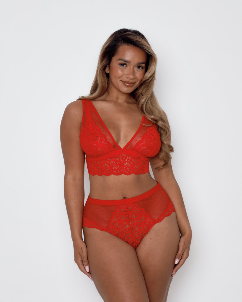 Curvy model wearing the Eva Bralette and Brief Set in vibrant chilli red, designed for fuller bust support and all-day comfort.