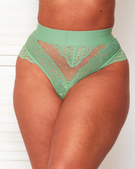 Front close-up of the Tutti Rouge Gia Basil Green high-waisted thong with sheer spot mesh and floral lace panels.