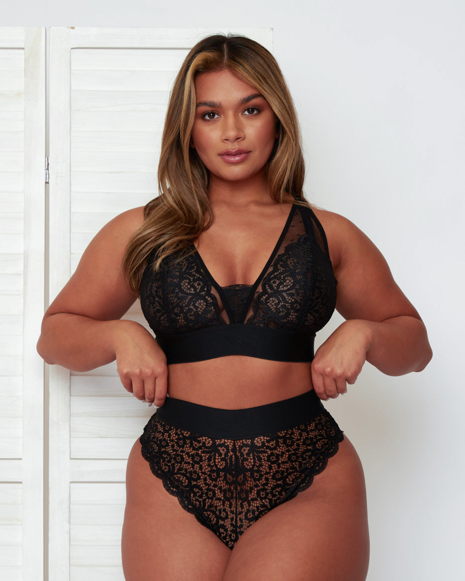 Close front view of the Hallie Bralette and High Waist Brief in Black by Tutti Rouge, highlighting intricate floral lace, sheer mesh inserts, and the plunging neckline with supportive underband.