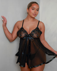 Back view of the Tutti Boudoir Kaia Babydoll in Onyx Black, highlighting the lightweight sheer mesh, adjustable shoulder straps and elegant draped silhouette for a romantic look from every angle.