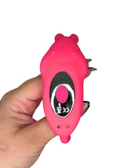 Pink device with a black screen held by a hand on a white background