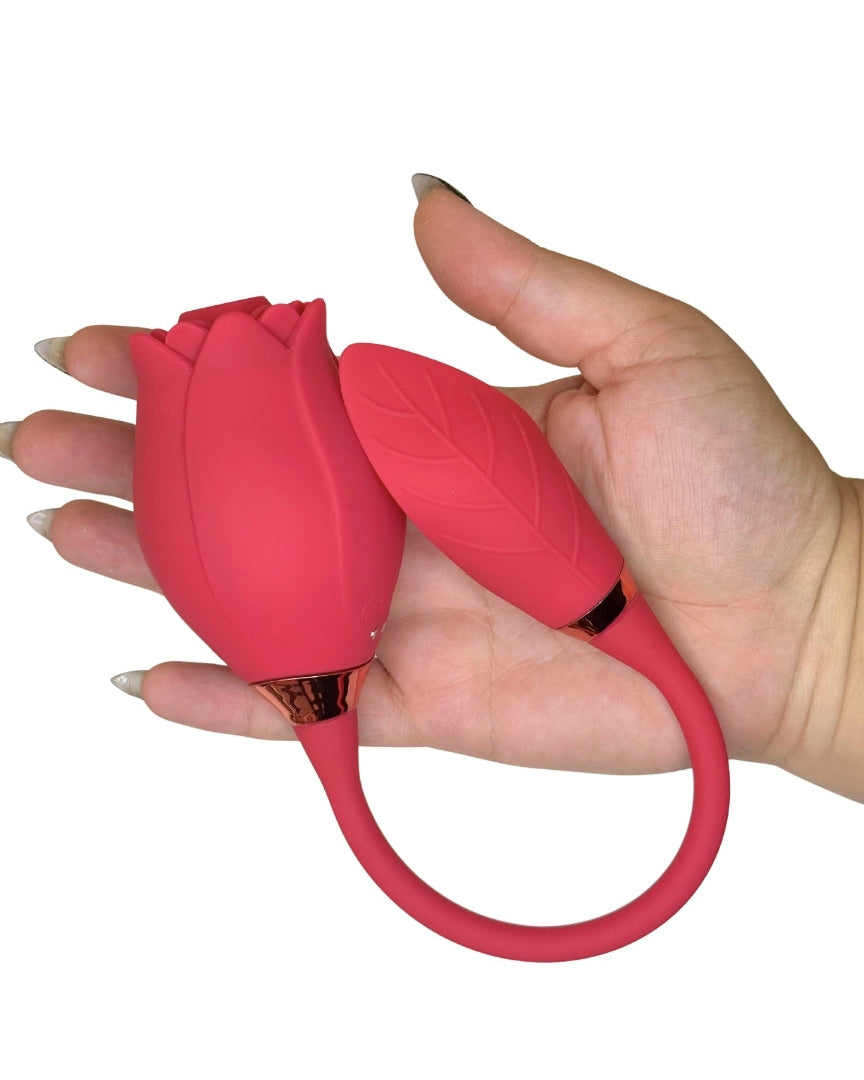Red tulip-shaped object held in a hand against a white background