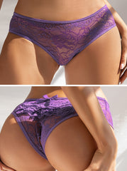 Purple lace underwear worn by a model on a plain background